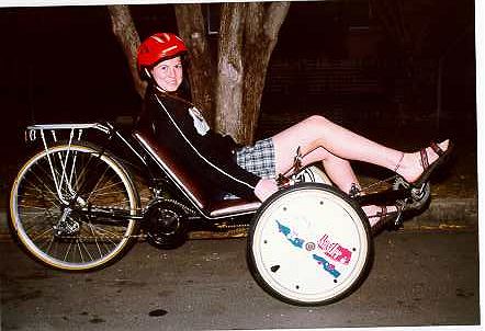 Rebecca on trike, side view